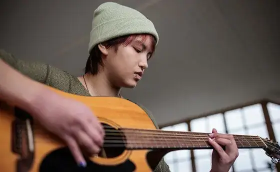 Student playing guitar