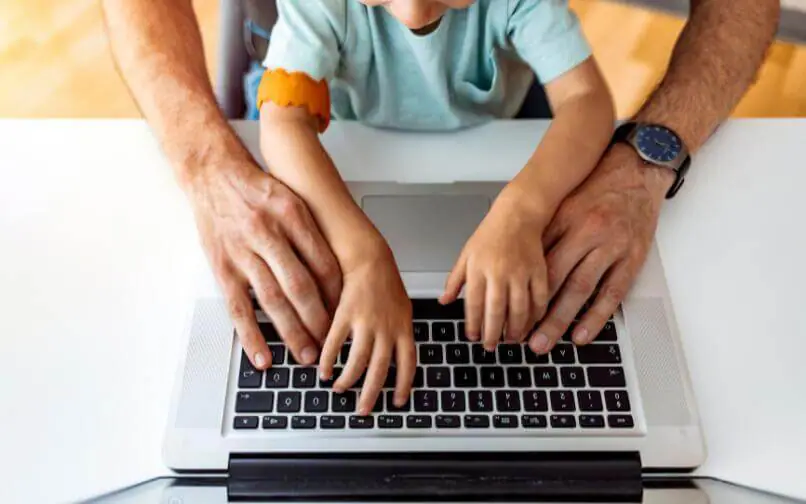 Parent and child on computer.