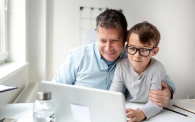 Parent and child on computer.