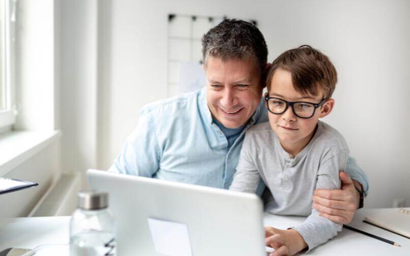 Parent and child on computer.